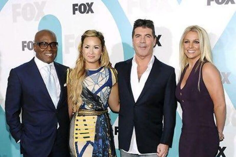 The X Factor US judges, from left, LA Reid, Demi Lovato, Simon Cowell and Britney Spears. Evan Agostini / AP Photo