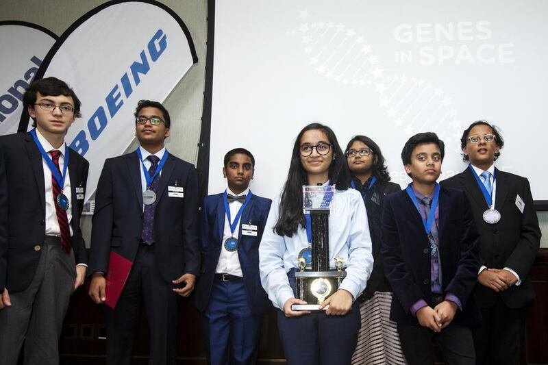 Winner Alia Al Mansoori stands with fellow finalists during the award ceremony for the Genes in Space competition. Christopher Pike / The National