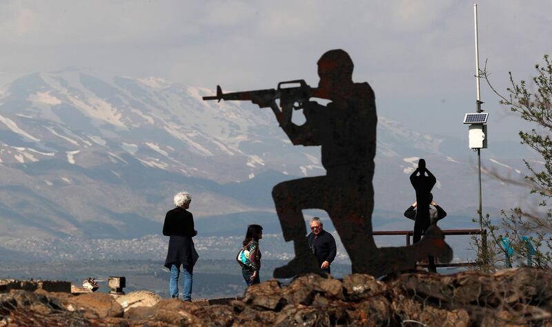 epa07455984 Israeli tourists stand near silhouetted cutout of an Israeli soldier at Ben Tal, next to the Israeli- Syrian border in the Golan Heights, 22 March 2019. US President Trump said in a tweet on 21 March 2019, that 'it is time for the United States to fully recognize Israel's Sovereignty over the Golan Heights' adding that it is of 'critical strategic and security importance to the State of Israel and Regional Stability.' Israel captured much of the Golan region from Syria in 1967 and then annexed it in 1981, a move that was never international recognized. Trump's remarks came as US Secretary of State Pompeo is on a trip in the Middle East and visited Jerusalem on the day.  EPA/ATEF SAFADI