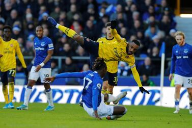 Everton's Moise Kean tackles Arsenal's Alexandre Lacazette during Saturday's 0-0 draw at Goodison Park. Reuters