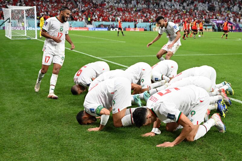 Morocco players celebrate after Abdelhamid Sabiri scored in the Group F match against Belgium at the Al-Thumama Stadium in Doha on November 27, 2022. AFP