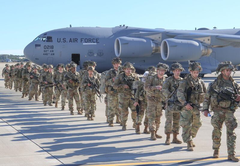 US. Army Paratroopers assigned to the 2nd Battalion, 504th Parachute Infantry Regiment, 1st Brigade Combat Team, 82nd Airborne Division, deploy from Pope Army Airfield, North Carolina.  AFP