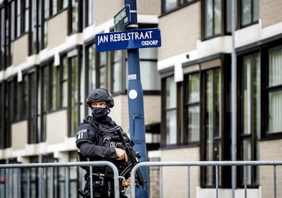 A security officer stands guard outside the court in Amsterdam-Osdorp where Taghi and others were sentenced. AFP 