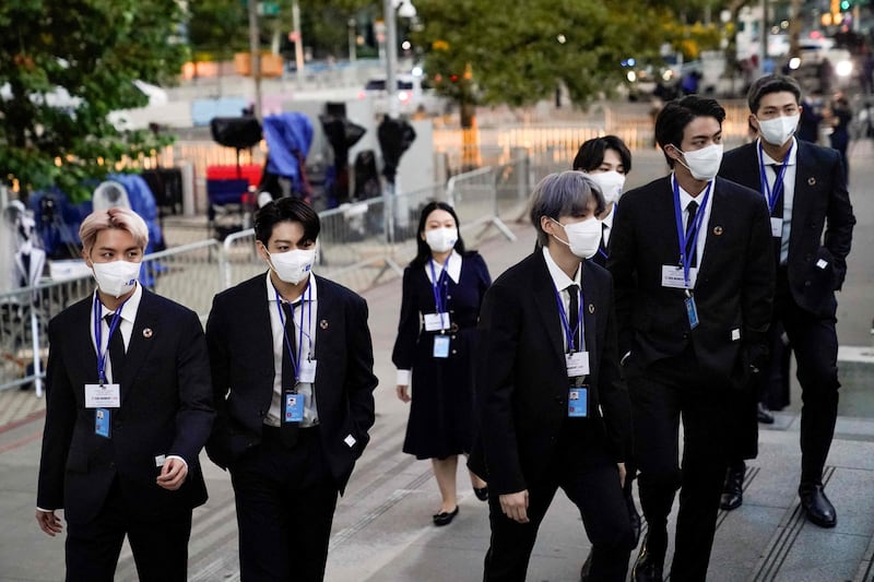 BTS arrives to security check-in at the United Nations headquarters during the 76th Session of the UN General Assembly in New York on September 20, 2021. AFP