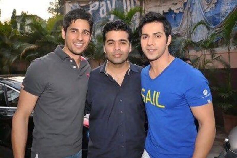 Malhotra, left, made his Bollywood debut in the 2012 film Student of the Year, directed by Karan Johar, centre, and which also stars Varun Dhawan, right. Photo: IANS