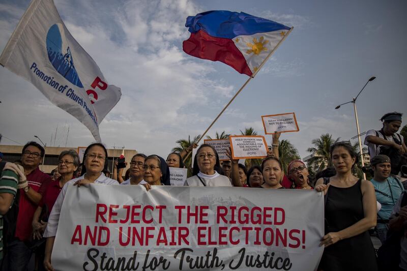 MANILA, PHILIPPINES - MAY 17: Catholic nuns take part in a protest versus alleged cases of electoral fraud, outside the Philippine International Convention Center where election officials are tallying votes for the congressional midterm elections on May 17, 2019 in Manila, Philippines. Philippine President Rodrigo Duterte is set to gain a tighter grip on power after his allies dominated a controversial midterm elections which have been marred with widespread incidents of vote buying, fraud, election-related violence, and glitches in the automated counting of votes according to local media reports. (Photo by Ezra Acayan/Getty Images)