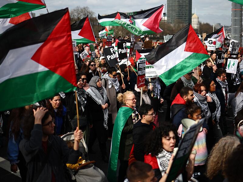 Pro-Palestinian supporters wave the Palestine flag at a London protest. The UK government's new definition of extremism could stoke Islamophobia, some MPs have told The National. AFP