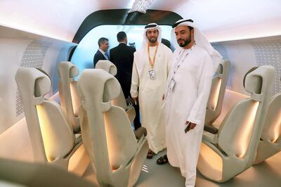 ABU DHABI ,  UNITED ARAB EMIRATES , SEPTEMBER 10 – 2019 :- Delegates looking the model of the Virgin Hyperloop One during the second day of the World Energy Congress held at ADNEC in Abu Dhabi. ( Pawan Singh / The National ) For Business. Story by Jennifer/Fareed