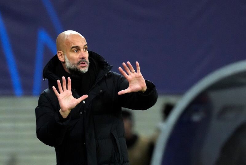Manchester City's coach Pep Guardiola gives instructions to his players. AP