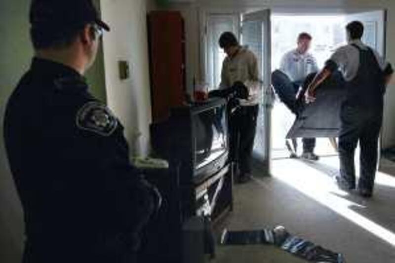 BOULDER, CO - DECEMBER 11: A sheriff's deputy supervises as an eviction team removes furnature from the apartment of Harvey Lesser, 58, on December 11, 2009 in Boulder, Colorado. Lesser, an unemployed software developer with chronic health problems related to obesity, said he stopped making rent payments after all of his savings were spent. Evictions and foreclosure rates nationwide soared in 2009, as millions of unemployed Americans were unable to pay the bills.   John Moore/Getty Images/AFP== FOR NEWSPAPERS, INTERNET, TELCOS & TELEVISION USE ONLY == *** Local Caption ***  433078-01-10.jpg *** Local Caption ***  433078-01-10.jpg