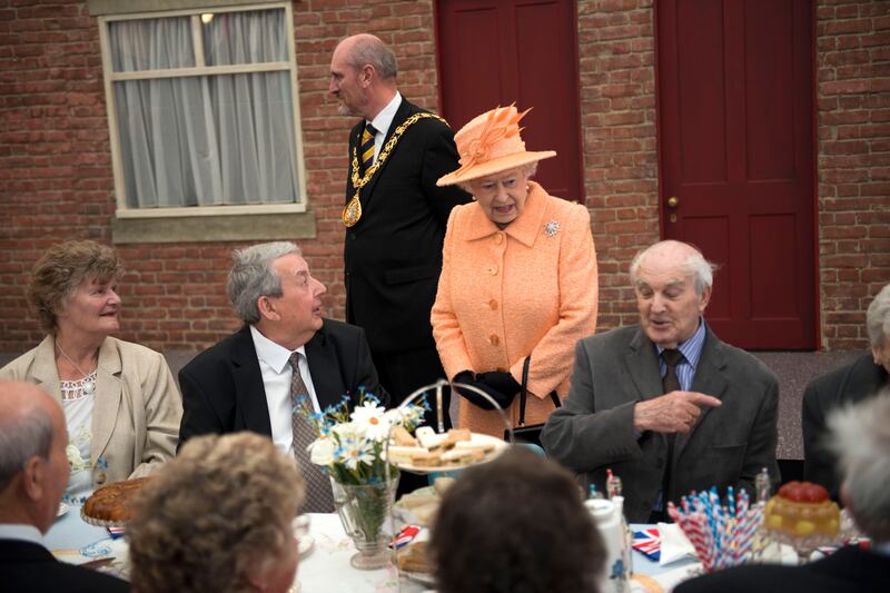 Queen Elizabeth chats to people attending a street party in Sunderland, north-east England as part of her diamond jubilee tour in July 2012.