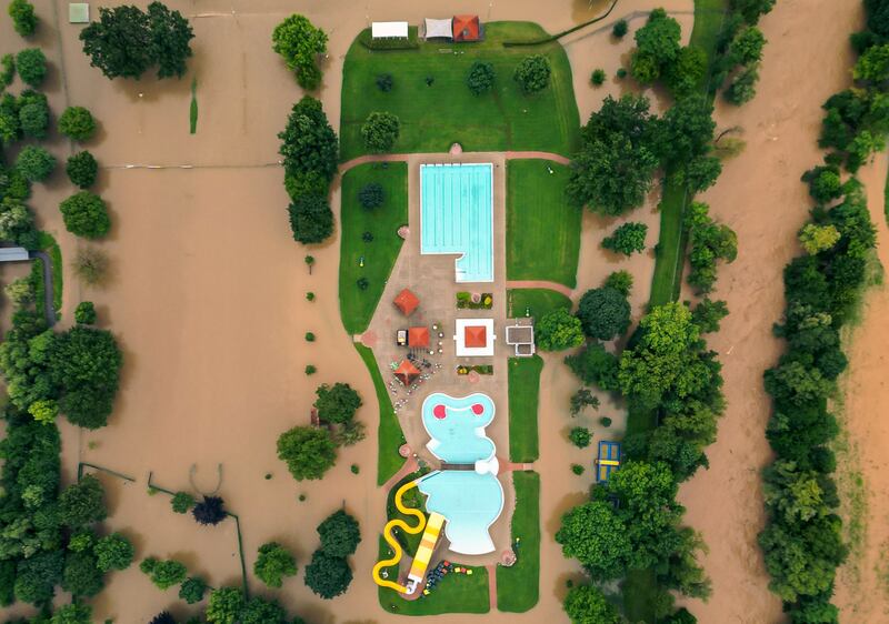 Floodwaters surround an outdoor swimming pool in the city of Leibnitz, south-eastern Austria. AFP