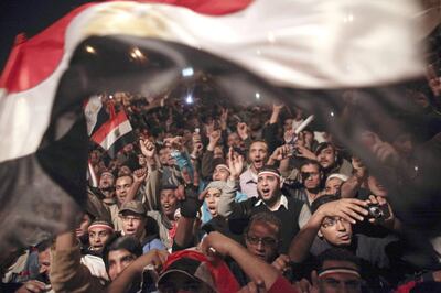 Egyptians celebrate the resignation of president Hosni Mubarak in Tahrir Square, Cairo, in February 2011. AP 