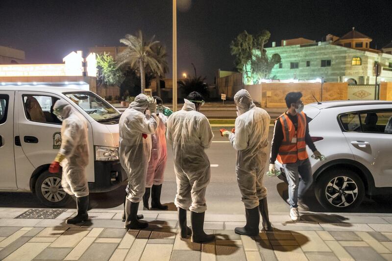 SHARJAH, UNITED ARAB EMIRATES. 26 MARCH 2020. Sharjah Municipal staff prepare to spray and disinfect the sidewalk along the Al Muntazah Str area of Sharjah near the Ajman border. (Photo: Antonie Robertson/The National) Journalist: None. Section: National.