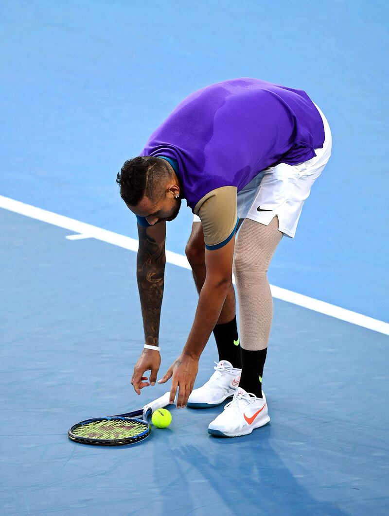 Nick Kyrgios puts down his racquet and refuses to play following a time violation. EPA