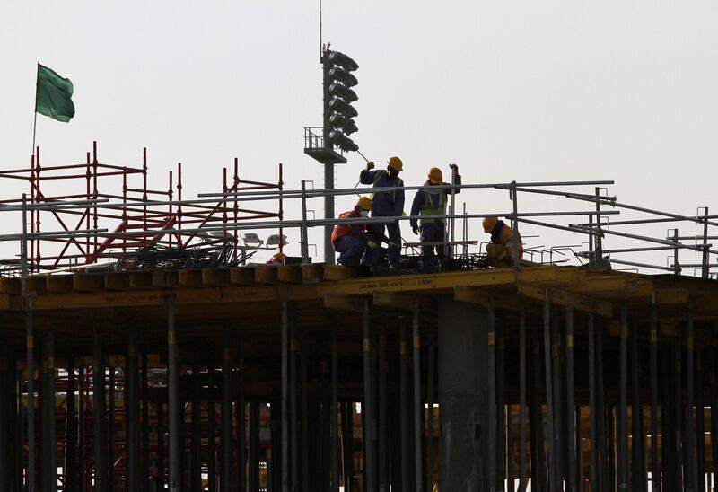 FILE PHOTO: Migrant labourers work at a construction site at the Aspire Zone in Doha, Qatar, March 26, 2016.  REUTERS/Naseem Zeitoon/File Photo