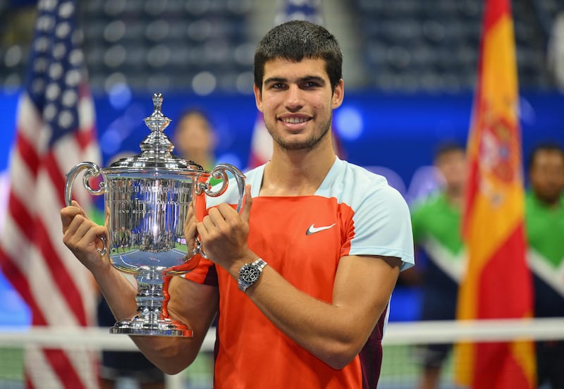 Spain's Carlos Alcaraz celebrates with the trophy. AFP