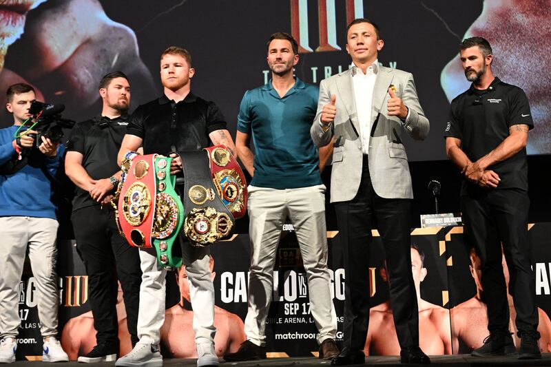 Mexican boxer Saul "Canelo" Alvarez and Kazakhstani boxer Gennady Golovkin, alongside boxing promotor Eddie Hearn, pose for photos during a press conference ahead of their fight for the undisputed super-middleweight championship, in Hollywood, California on June 24, 2022. AFP