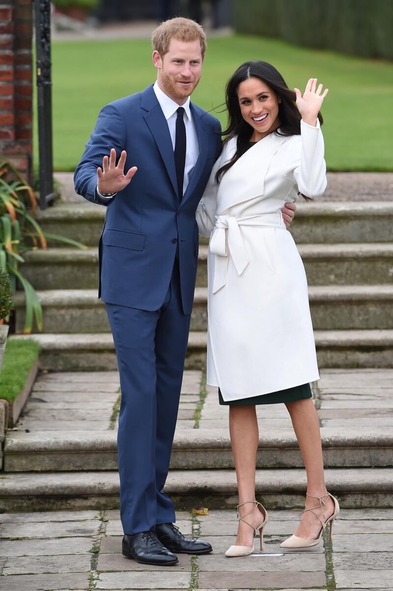 LONDON, ENGLAND - NOVEMBER 27:  Prince Harry and actress Meghan Markle during an official photocall to announce their engagement at The Sunken Gardens at Kensington Palace on November 27, 2017 in London, England.  Prince Harry and Meghan Markle have been a couple officially since November 2016 and are due to marry in Spring 2018.  (Photo by Eddie Mulholland-WPA Pool/Getty Images)