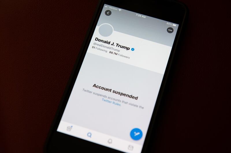 The suspended Twitter Inc. account of U.S. President Donald Trump on a smartphone arranged in Washington, D.C., U.S., on Saturday, Jan. 9, 2021. Twitter permanently banned Trump's personal account on Friday for breaking its rules against glorifying violence, marking the most high-profile punishment the social-media company has ever imposed and the end of Trump's relationship with his favorite social media megaphone. Photographer: Graeme Sloan/Bloomberg