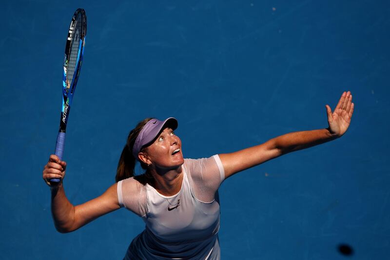Maria Sharapova serves in her first round match against Tatjana Maria. Clive Brunskill / Getty Images