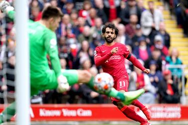 Liverpool's Mohamed Salah scores a goal before it is disallowed for offside during the Premier League match at Anfield, Liverpool. Picture date: Saturday August 21, 2021.