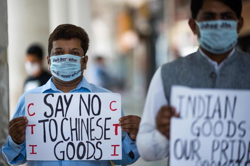 Anti-China protesters display placards urging citizens to boycott Chinese goods at a market in New Delhi. Twenty Indian soldiers were killed during "hand-to-hand' fighting with Chinese troops in a disputed Himalayan region, India's military said, the first deadly clash between the nuclear powers in decades.  AFP