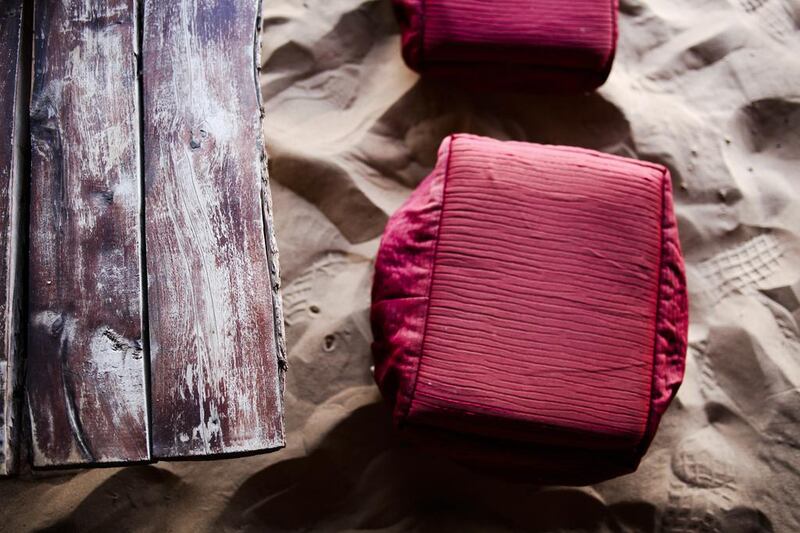 On the left is a table made from a dead gaf tree and stools. Lee Hoagland / The National