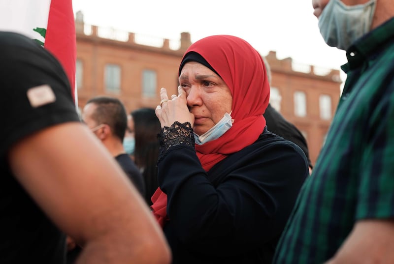 A woman cries  in Toulouse, during a gathering to pay tribute to the Lebanese people.  AFP