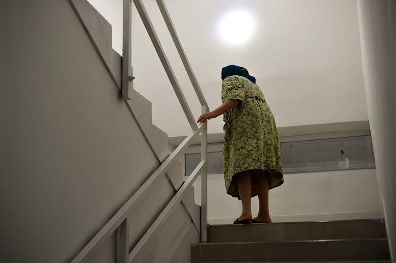 A woman from Ukraine walks up the stairs to her room in a hostel in Budapest, Hungary. AP