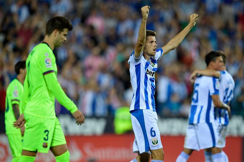 Leganes' Spanish midfielder Gerard Gumbau celebrates their win at the end of the Spanish league football match Club Deportivo Leganes SAD against FC Barcelona at the Estadio Municipal Butarque in Leganes on the outskirts of Madrid on September 26, 2018. / AFP / OSCAR DEL POZO

