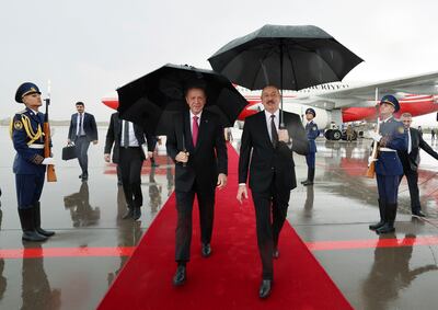 Turkish President Recep Tayyip Erdogan is welcomed by Azerbaijan President Ilham Aliyev. AP