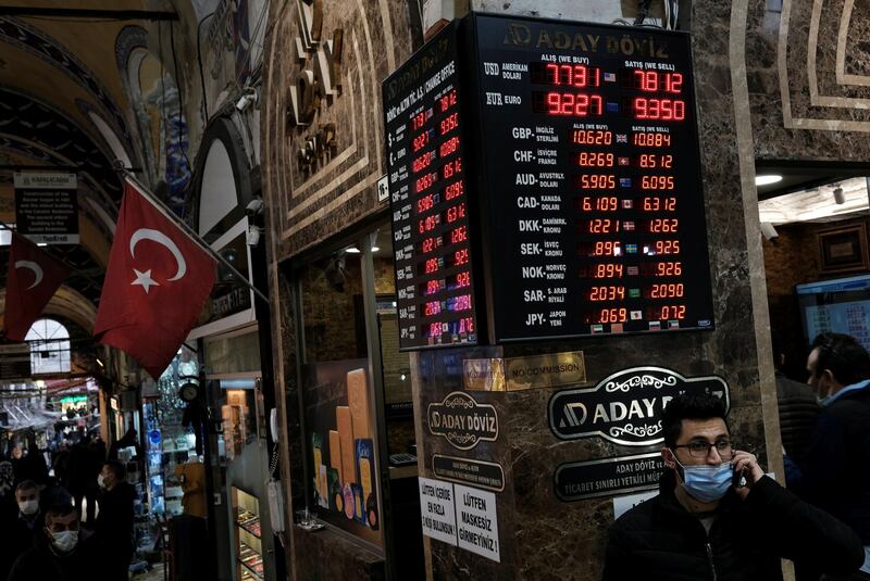 A board shows the currency exchange rates outside an exchange office in Istanbul, Turkey. Reuters