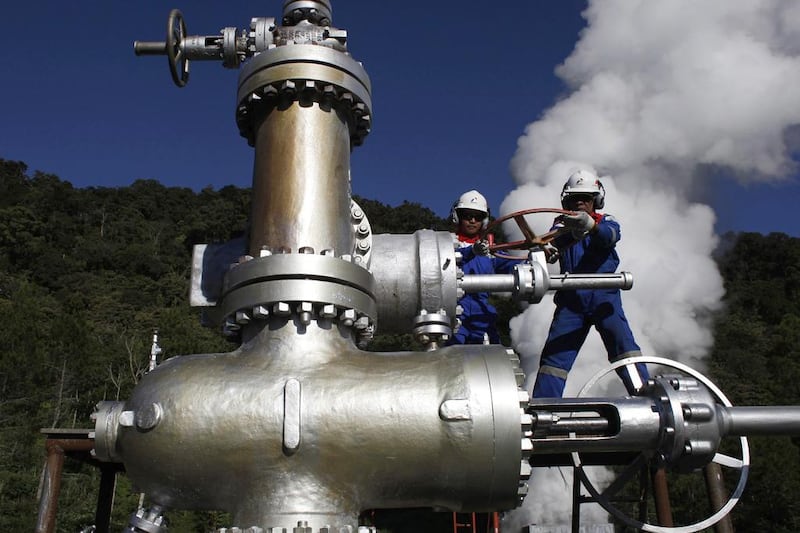 Letting off steam: workers at Pertamina Geothermal Energi rotate a valve during a production test at Karaha geothermal well in Tasikmalaya, in Indonesia's West Java province. The Karaha Geothermal Power Plant is scheduled to supply power at the end of 2016. (Beawiharta / Reuters / April 19, 2014)