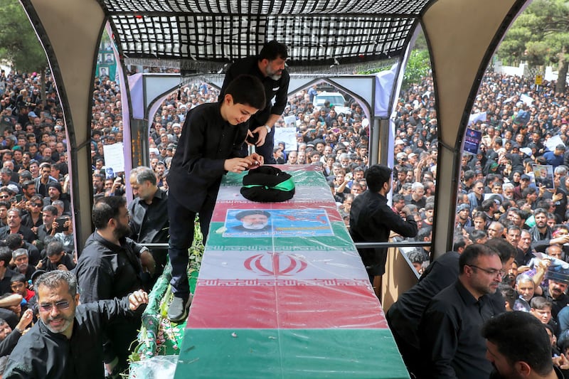 Mourners pay their respects at the funeral procession of late Iranian president Ebrahim Raisi, in the eastern city of Birjand. AFP