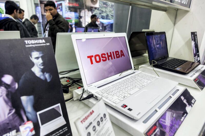 Toshiba Corp. laptop computers are displayed for sale at a company store in Nehru Place IT Market, a hub for the sale of electronic goods and computer accessories, in New Delhi, India, on Friday, Feb. 14, 2014. Toshiba is to invest $500 million in India in five years to fiscal year 2017. Photographer: Graham Crouch/Bloomberg