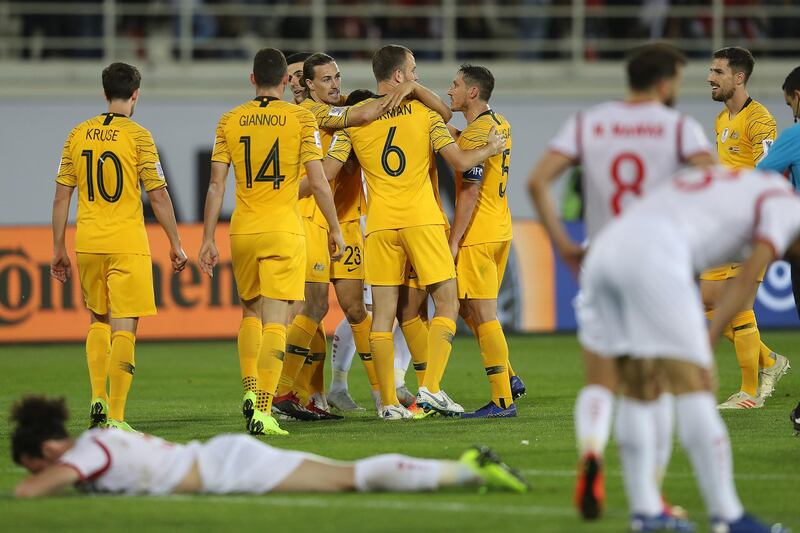 Syria players are dejected following Tomas Rogic's late winning goal for Australia. Getty Images