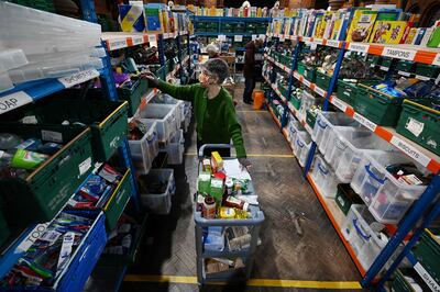 Volunteers work at the Trussell Trust's Norwood and Brixton Foodbank in St Margaret's the Queen Church in Brixton, South London. AFP