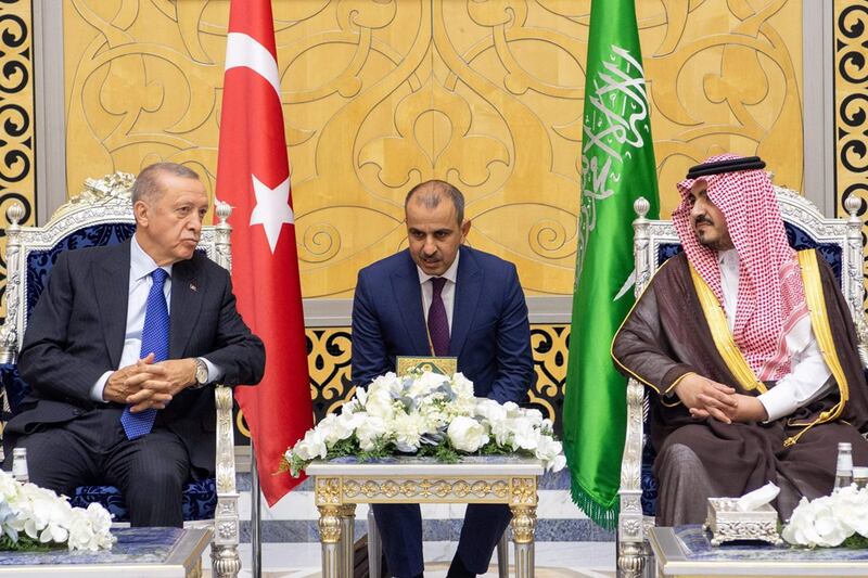 Mr Erdogan is received by the Deputy Governor of Makkah province, Prince Badr bin Sultan, on his arrival in Jeddah. AFP