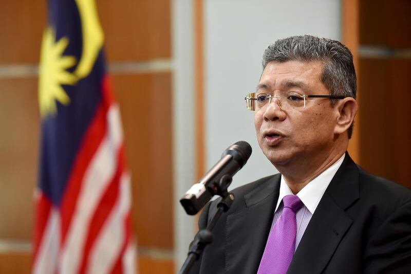 Malaysia Foreign Minister Saifuddin Abdullah speaks during a press conference in Putrajaya, Malaysia, Wednesday, Jan. 16, 2019. Malaysia's foreign minister says the government will not budge over a ban on Israeli athletes in para swimming competition and decided that the country will not host any events in future involving Israel. (AP Photo/Yam G-Jun)