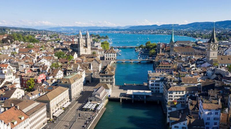 ZURICH, SWITZERLAND - JULY 12: An aerial drone view of the city centre of Zurich, Limmat River, Lake Zurich, and the Grossmuenster Church stand during the coronavirus pandemic on July 12, 2020 in Zurich, Switzerland. Switzerland has largely lifted most of its coronavirus lockdown measures and has so far registered approximately 33,000 infections.  (Photo by Christian Ender/Getty Images).