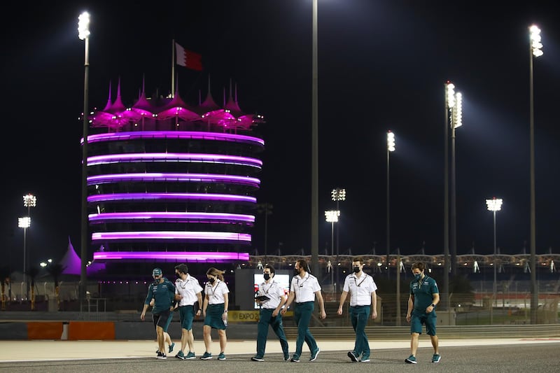 Sebastian Vettel of Germany and the Aston Martin F1 Team walks the track with colleagues in preparation for the F1 Grand Prix of Bahrain at Bahrain International Circuit. Getty
