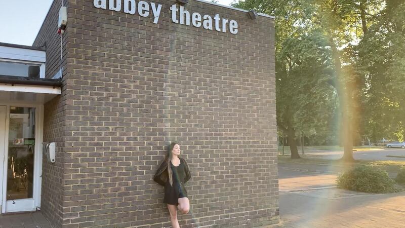 Royal Ballet dancer Tierney Heap leans against a wall of the Abbey Theatre in St Albans, north London. Reuters