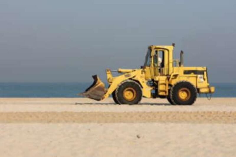Bulldozer going for construction work near the beach at Umm Suqueim area of Dubai.