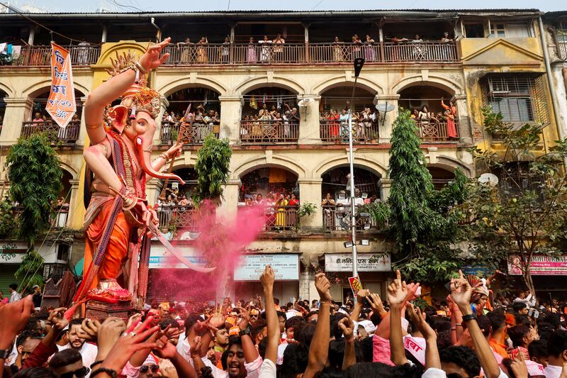Devotees carry an idol of the Hindu deity Ganesh at a festival in Mumbai, India. Reuters