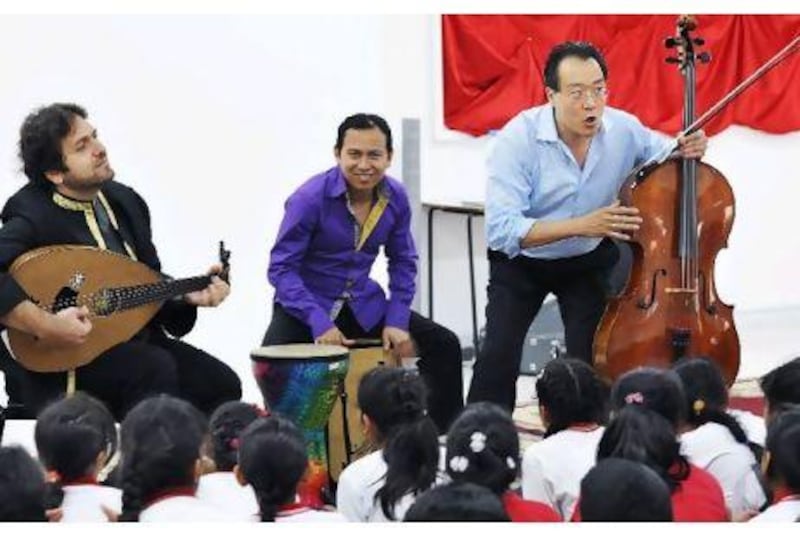 Award winning cellist Yo-yo Ma, right, speaks to students at Al Rabeeh School in Abu Dhabi. Photo: Al Rabeeh school