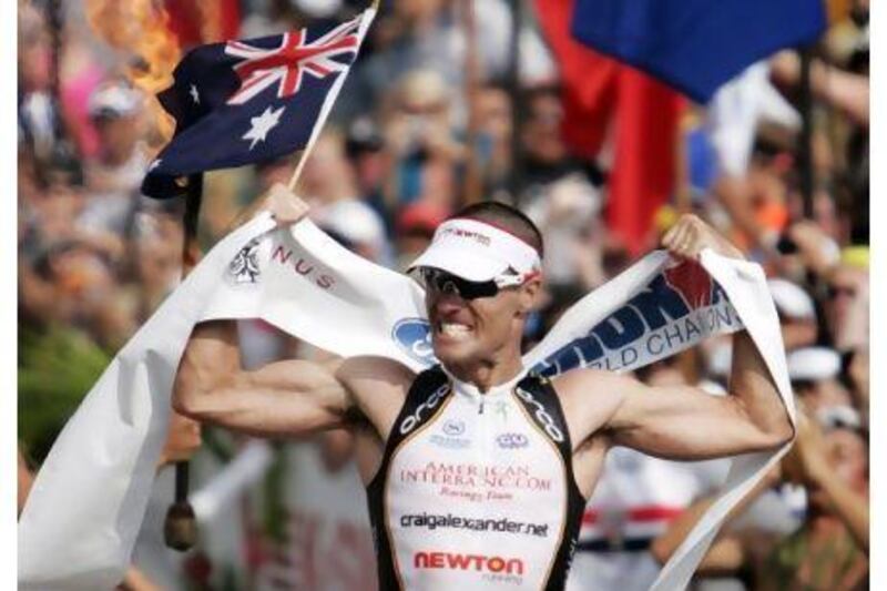 Craig Alexander celebrates after winning the Ironman World Championship triathlon for the second time in a row in 2009. Hugh Gentry / Reuters