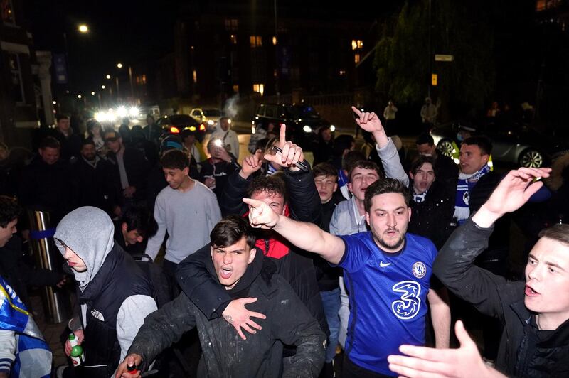 Chelsea fans celebrate outside their Stamford Bridge ground after beating Real Madrid 2-0 in their semi-final second leg and make the Champions League final where they will take on Manchester City. PA