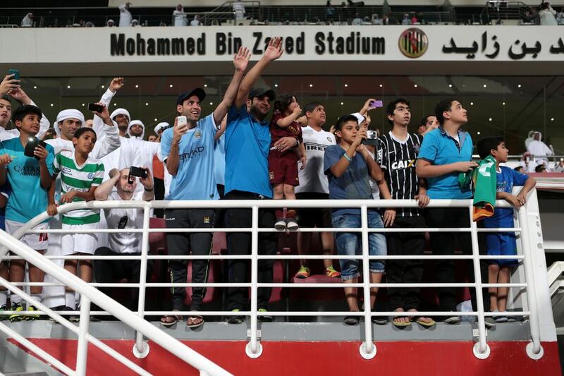 Fans flock to the Mohammed Bin Zayed Stadium in Abu Dhabi on May 14, 2014, for an open training session by English Premier League champions Manchester City. Christopher Pike / The National
