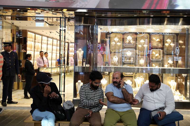 People rest at the gold souq on a Ramadan afternoon
